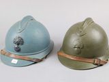 pair of british ww1 helmets with leather straps
