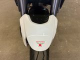 a close up of a motorcycle parked in a garage