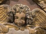 a statue of an angel with wings on it ' s head