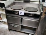 a stove with two pans on top of it in a store