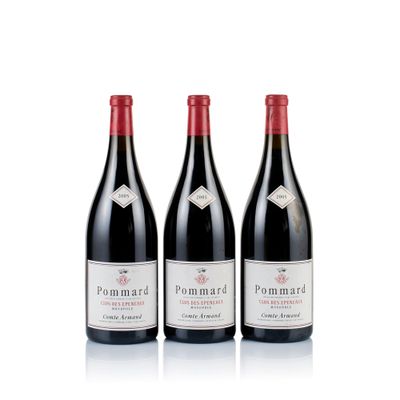 three bottles of red wine sitting next to each other on a white surface