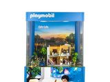 un gros plan sur une boîte de Playmobil contenant une maison de poupées