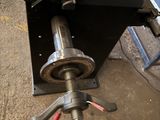 a machine that is sitting on the ground with tools in it