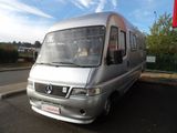 a silver van parked on the side of the road