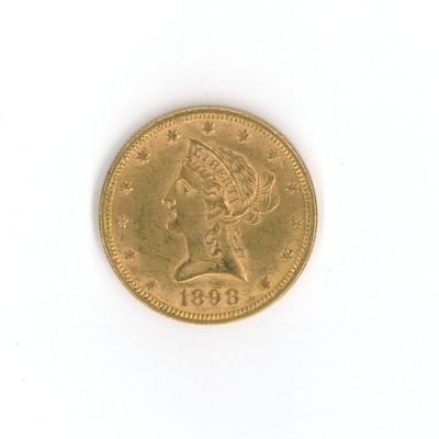 l'image d'une pièce d'or sur laquelle figure une tête de femme