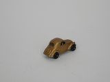 a small toy car that is sitting on a white surface
