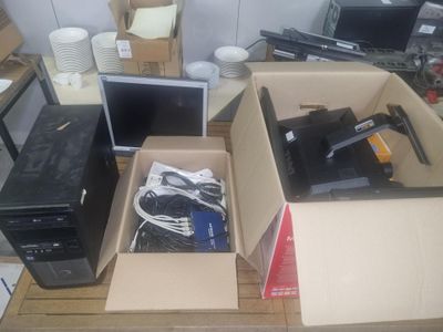 two boxes with computers in them sitting on a table