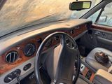 a car dashboard with a steering wheel and a dash board