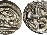 a silver coin with an image of a man on a horse