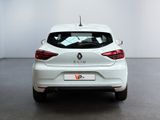 the rear end of a white car in a white room
