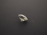 a white diamond on a black surface
