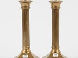 pair of antique brass candlesticks on marble bases