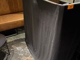 a black table with a black cloth covering it