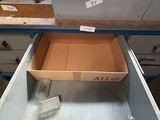 a box of tools sitting in the drawer of a workbench