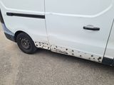 a white van that has been vandalized with black paint