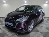 a picture of a purple car parked on a checkered floor