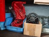 a pile of assorted items sitting on the floor