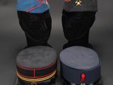 three hats are lined up on top of each other on a mannequin head