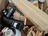 a cardboard box full of assorted items in a room