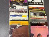 a lot of cassettes that are on a table