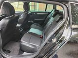 a view of the back seats of a car from the driver ' s seat