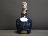 an image of a bottle of liquor sitting on top of a table