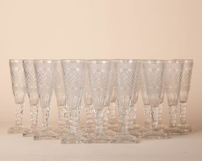 a lot of glasses that are sitting on a table
