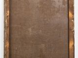 an old wooden frame with a brown canvas on a white wall