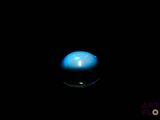 an image of a blue ball in the dark