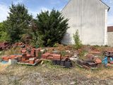 a lot of bricks that are sitting in the grass