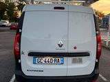 a white van that is parked in a parking lot