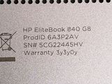 a close up of a silver electronic device with a warrant label on it