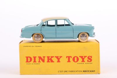 a blue toy car sitting on top of a yellow box