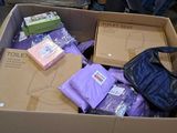 a box of toilet paper and a bag of toilet paper