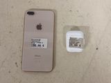 an iphone that is sitting next to a charger