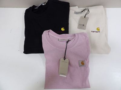 three t - shirts on a shelf with a price tag on it