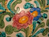 a large vase with a floral design on it