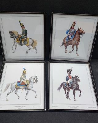 three framed pictures of soldiers riding horses and a soldier on a horse