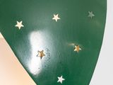 a close up of a lamp with a green shade and gold stars on it