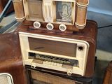 three old radio ' s stacked on top of each other