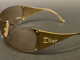 christian dior sunglasses with a gold frame and brown lens