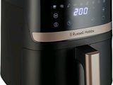 an image of a black air fryer sitting on top of a counter