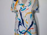 an image of a dress on a mannequin with paint splatters all over it