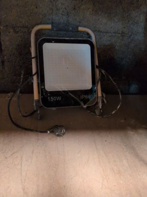 a small television sitting on top of a wooden floor