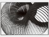 a black and white photo of a spiral object