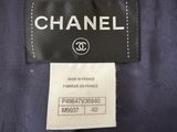 a label on a chanel jacket with a black and white label