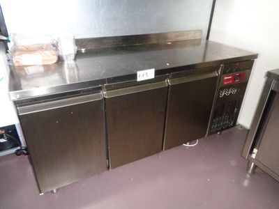 a stainless steel counter top in a commercial kitchen