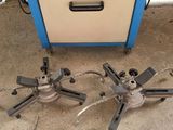 two machines that are sitting on the floor next to each other