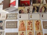 a lot of cards on the table with a box of them