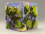 a picture of a painting of some trees on a table
